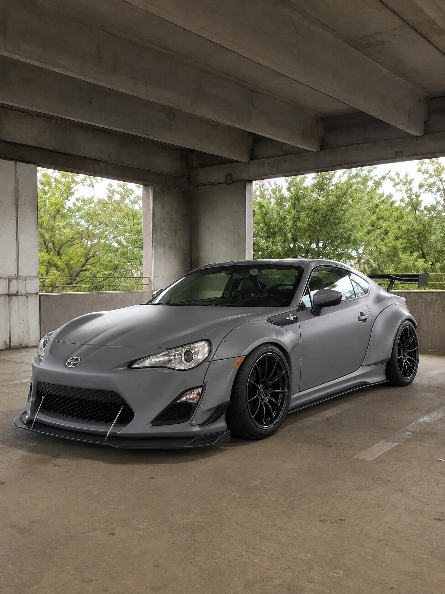 The same coupe rendered with widebody flares and a satin wrap by the ModMyCar studio