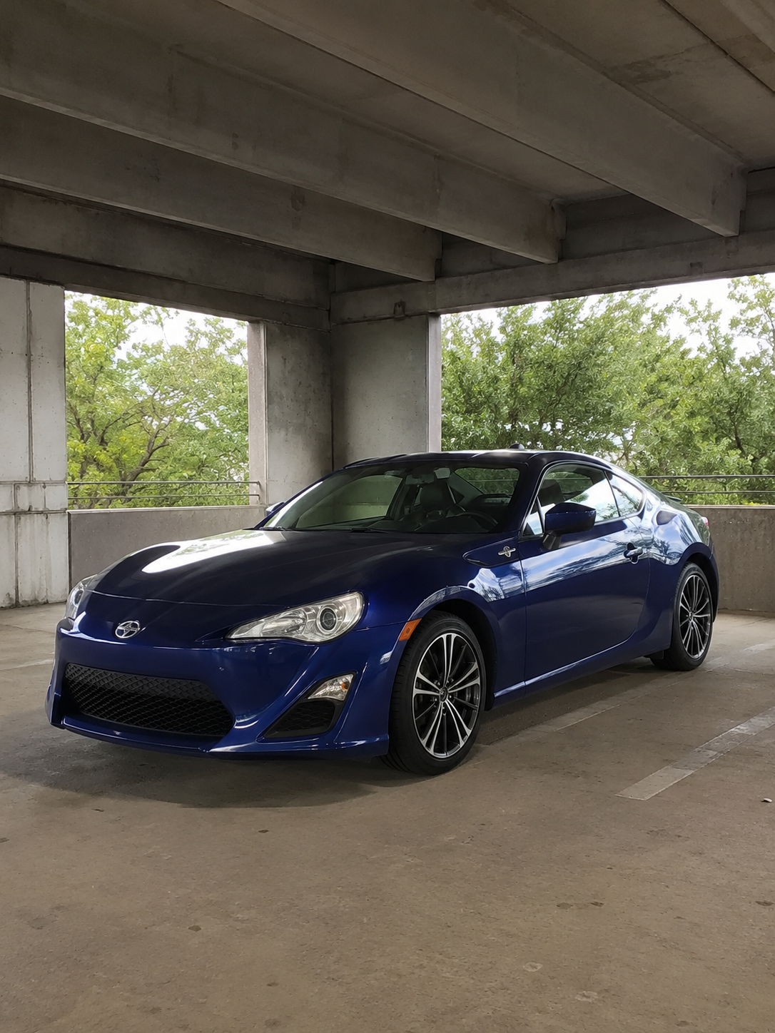 A stock coupe photographed outdoors