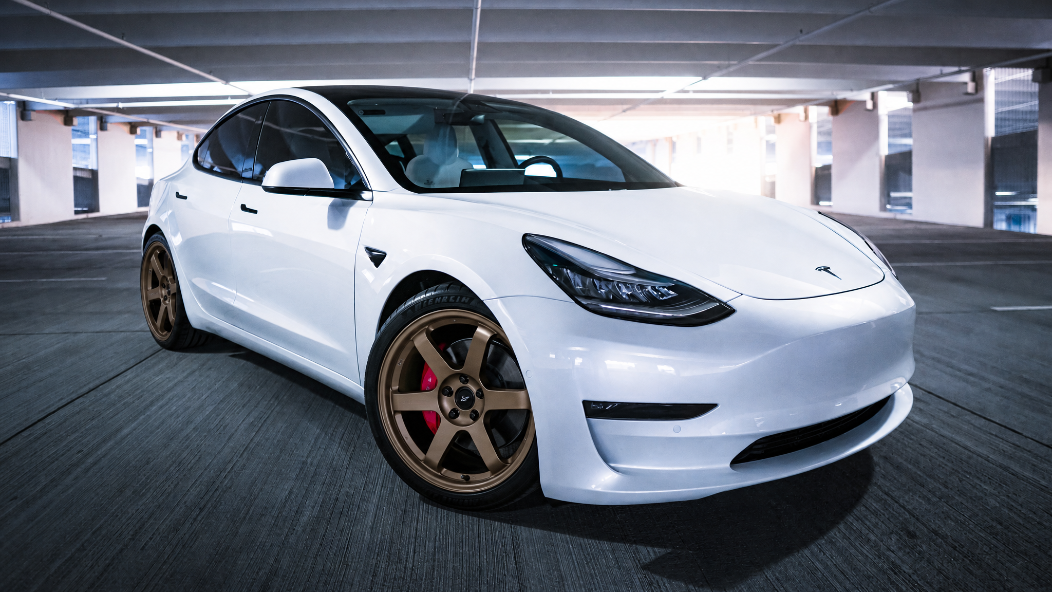 The same sedan re-rendered with bronze six-spoke wheels by the ModMyCar studio