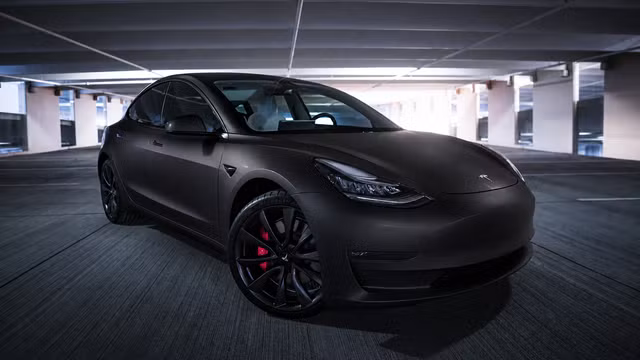 Satin black wrap preview on the same car