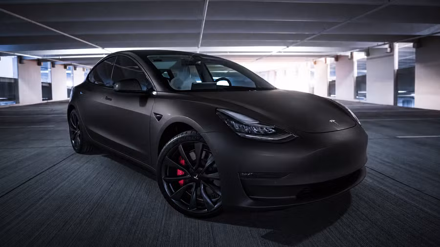 The same Model 3 previewed in a satin black wrap — AI generated